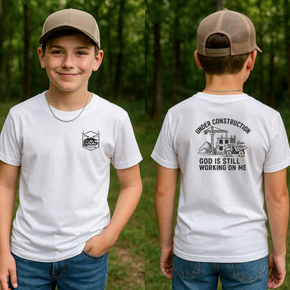 👷 Under Construction Kids Tee – “God Is Still Working on Me”